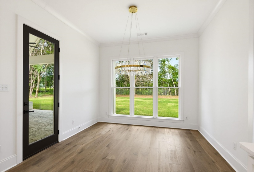 Hardwood-finish flooring complementing a contemporary chandelier