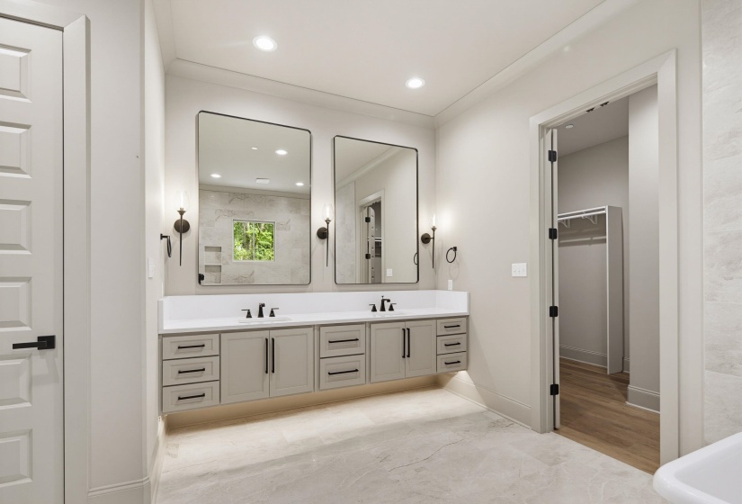 Double vanity with light gray cabinetry, quartz countertop, and matte black fixtures