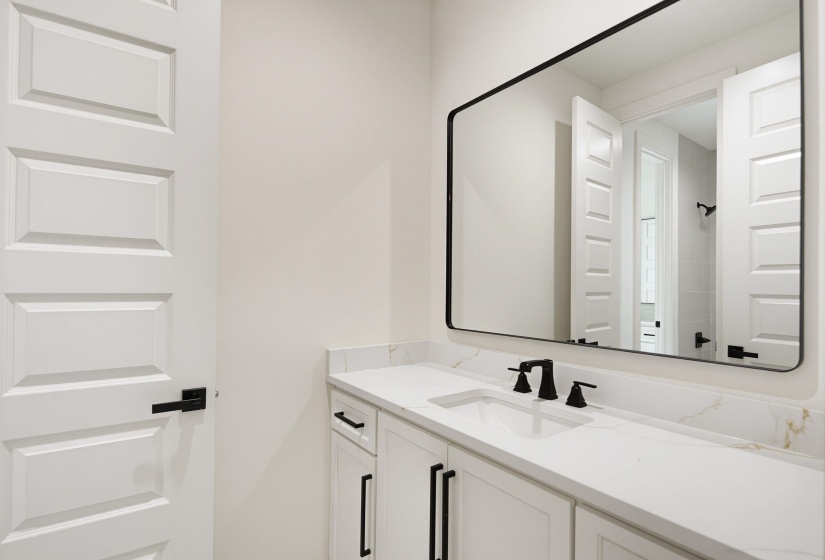 Contemporary bathroom vanity with a white countertop and integrated rectangular sink