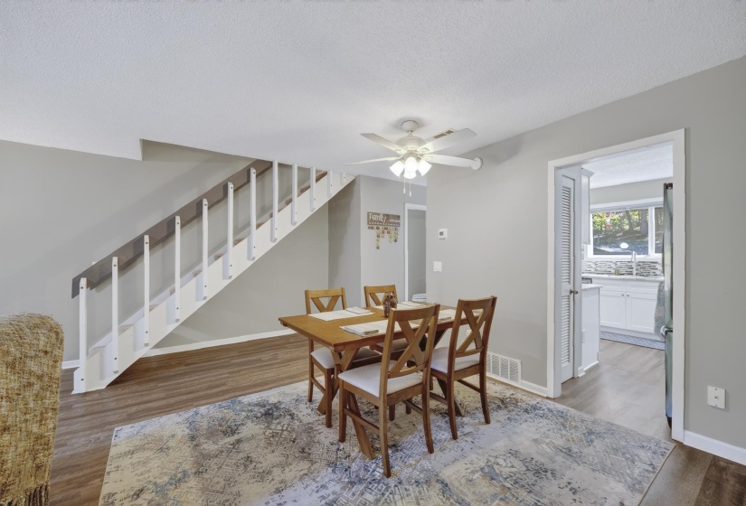 Interior room featuring wood-finish flooring, light gray wall paint, and white trim