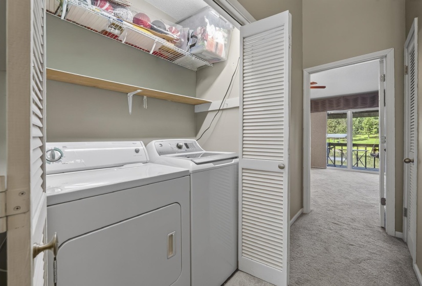 Dedicated laundry closet with white louvered bifold doors to Level 2 hallway