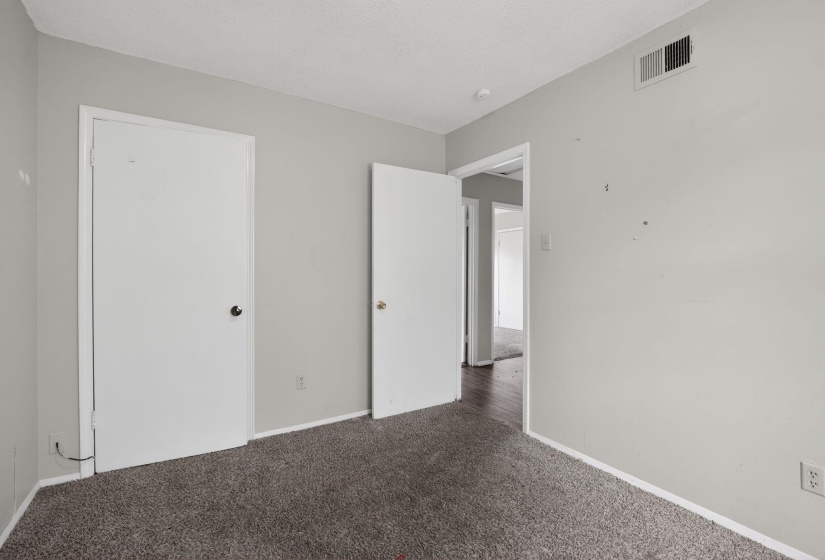 Unfurnished bedroom featuring carpet flooring and baseboards