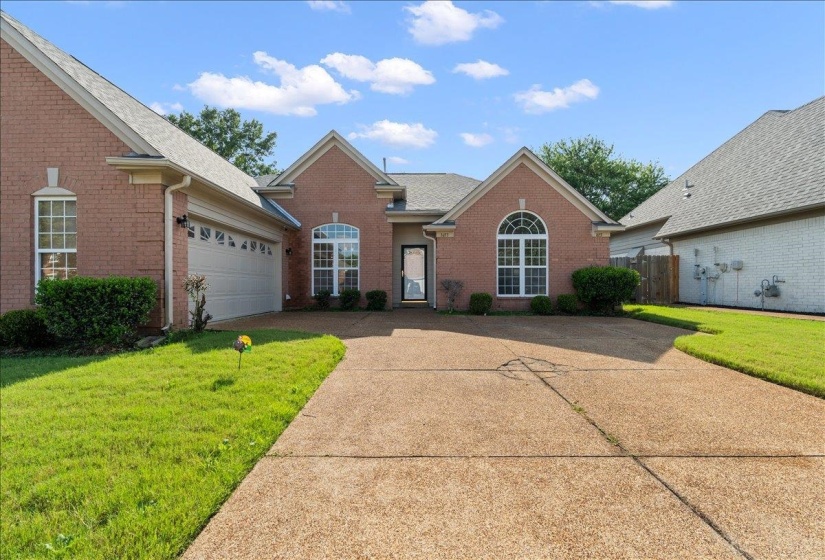 Traditional brick exterior with an attached two-car garage