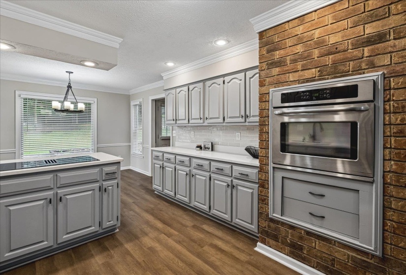 Stainless steel built-in oven integrated into a brick wall