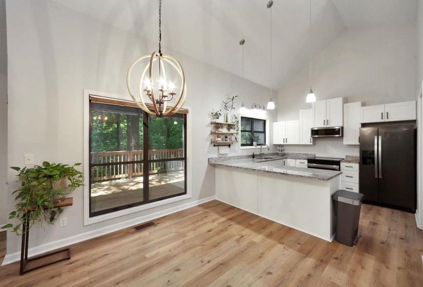 Vaulted ceilings enhancing the open-concept kitchen and dining area