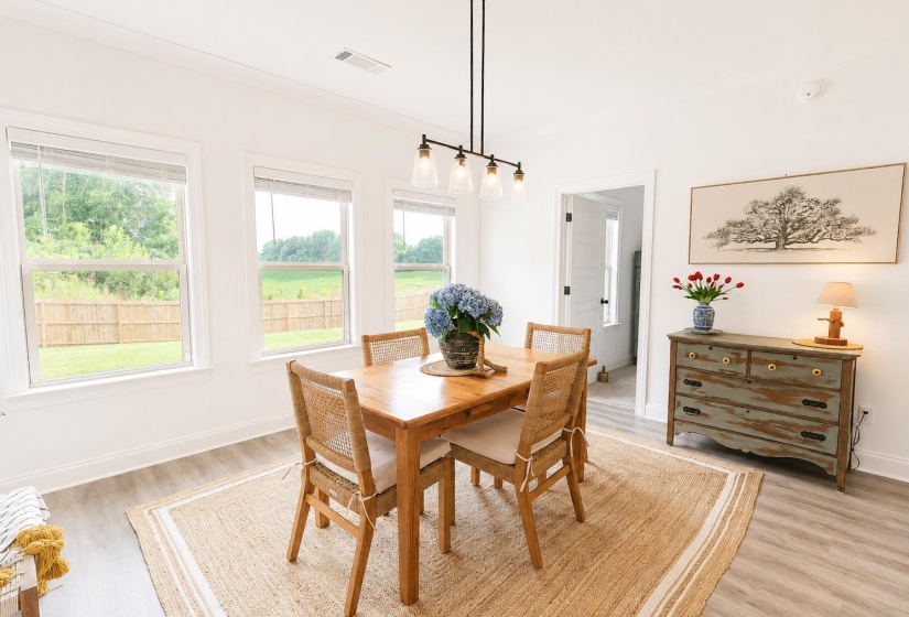 Bright interior space with wood-finish flooring and white walls