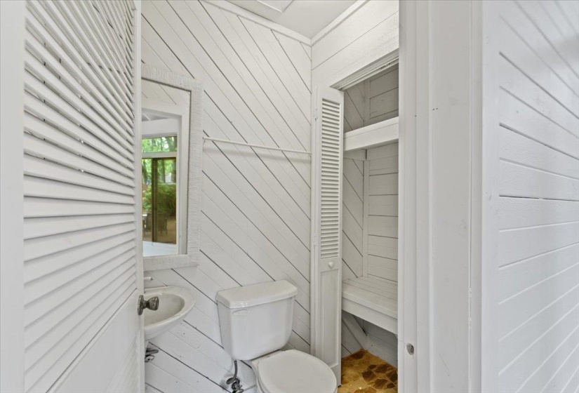Bathroom with wooden walls and toilet
