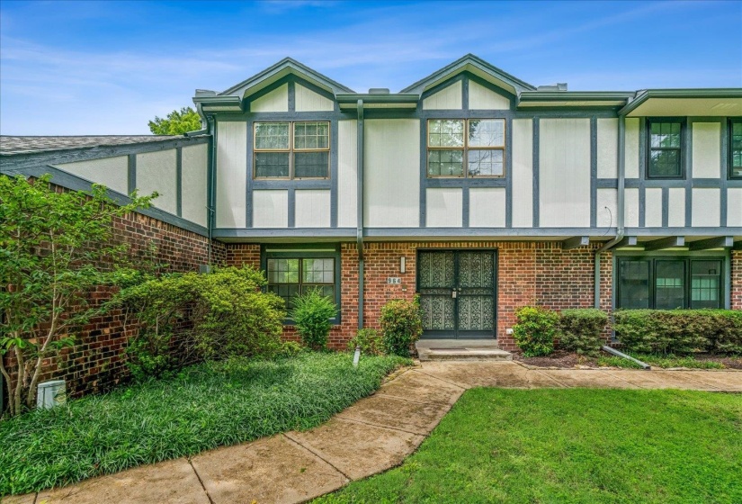 Brick and Tudor-style exterior with dark trim detailing