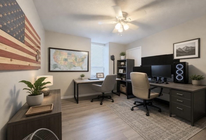 Bedroom or office, wood-finish flooring, a ceiling fan, and window blinds