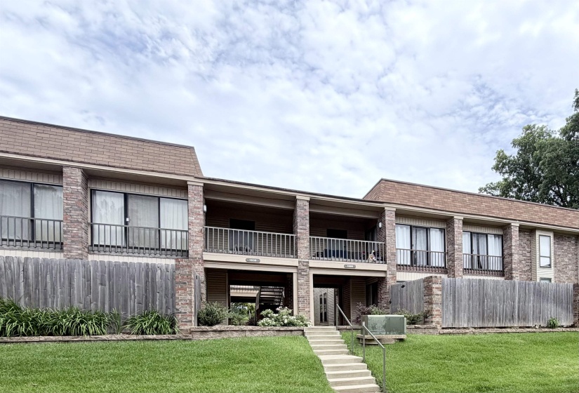 Multi-story building featuring brick and siding