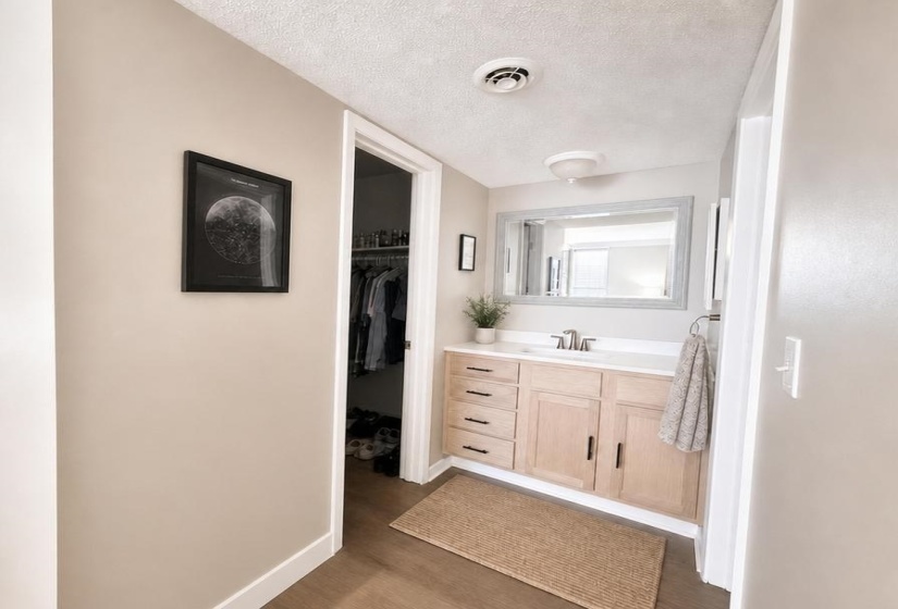 En suite Bathroom with new vanity and white countertop.