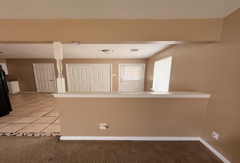 Half-wall partition with white trim detail