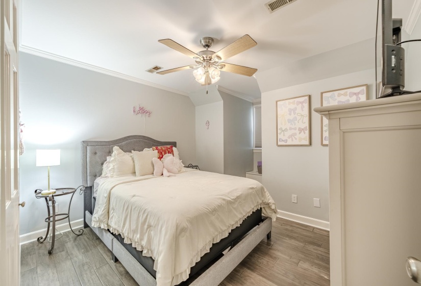 Bedroom featuring wood-finish flooring and a ceiling fan