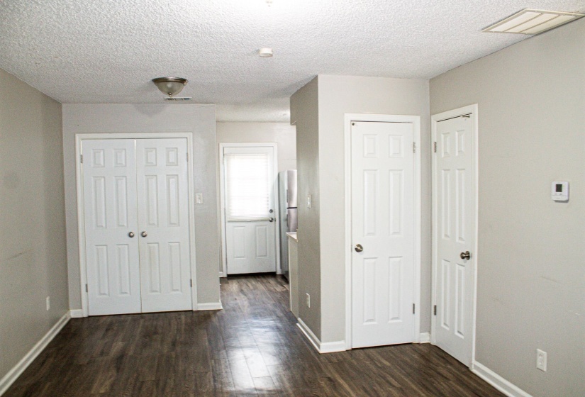 Room featuring wood-finish flooring and neutral wall tones