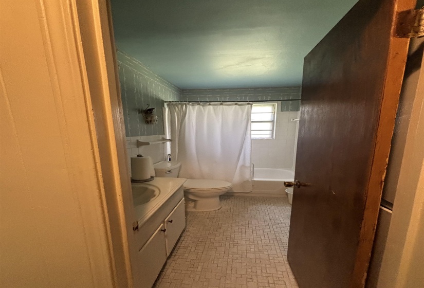 Full bathroom with vanity and shower / tub combo with curtain