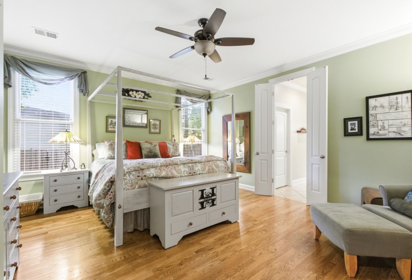 Hardwood-finish flooring throughout, featuring a ceiling fan with integrated lighting