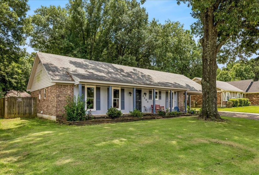 Ranch-style residence featuring a brick and siding exterior with a pitched roof