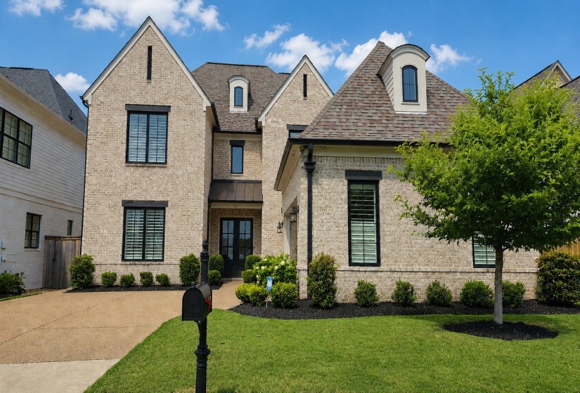 Beautiful curb appeal, accented by lush landscaping