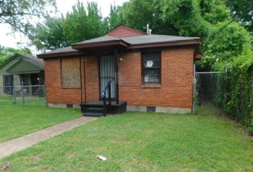 Brick exterior with a covered front entry