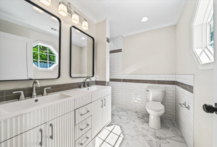 Dual vanity with fluted cabinetry and integrated sinks