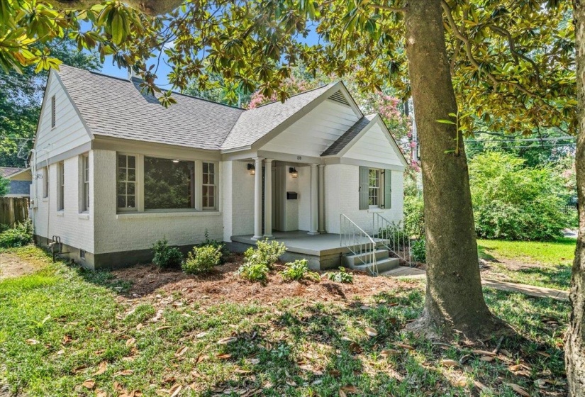 Classic white exterior with a covered porch and column accents