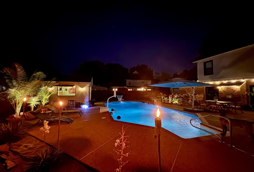 In-ground pool featuring integrated lighting