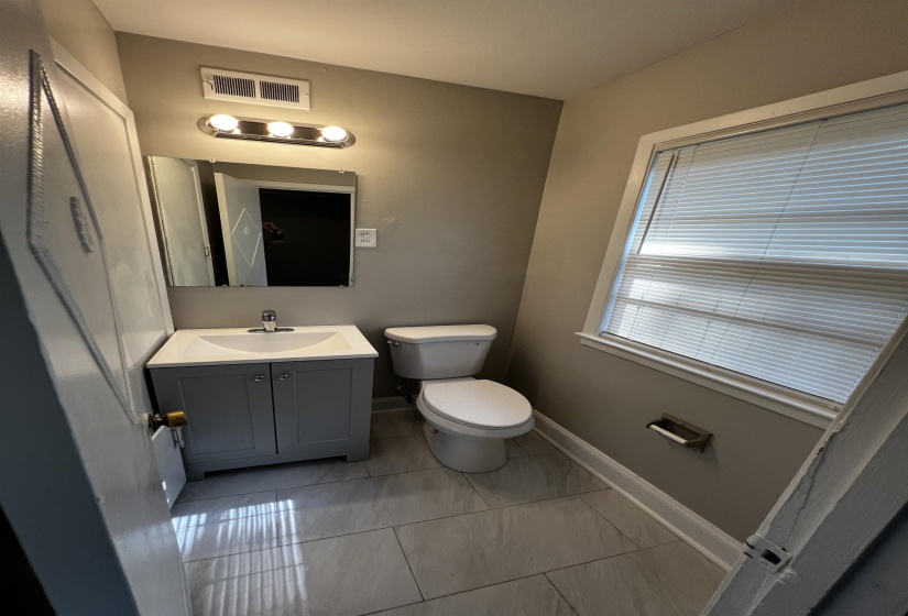 Bathroom featuring toilet and vanity