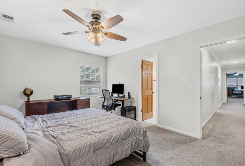 Bright room with neutral wall paint and light gray carpet