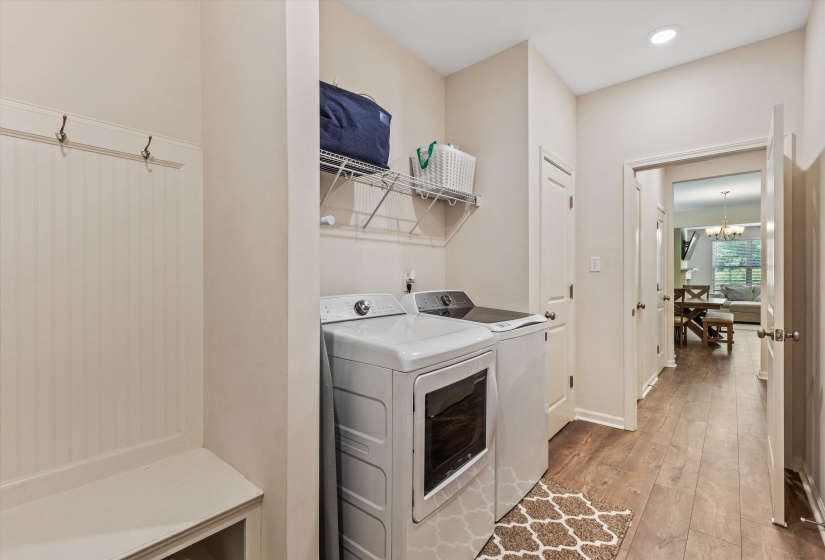 Dedicated laundry area featuring a full-size washer and dryer