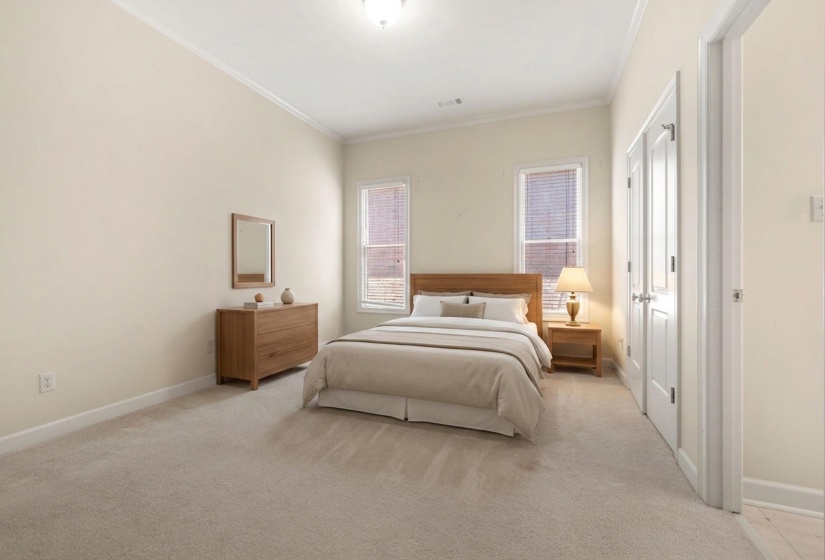 Interior room with vaulted ceilings and wall-to-wall carpeting