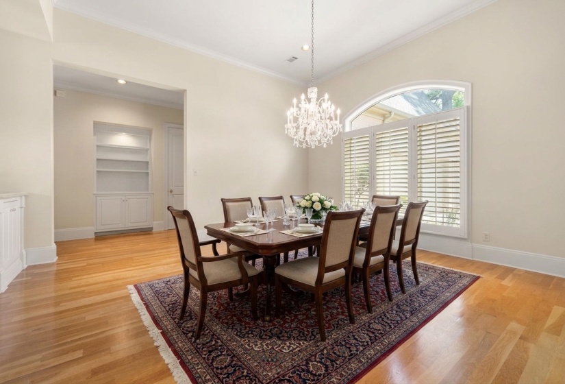 Formal dining space featuring a prominent crystal chandelier