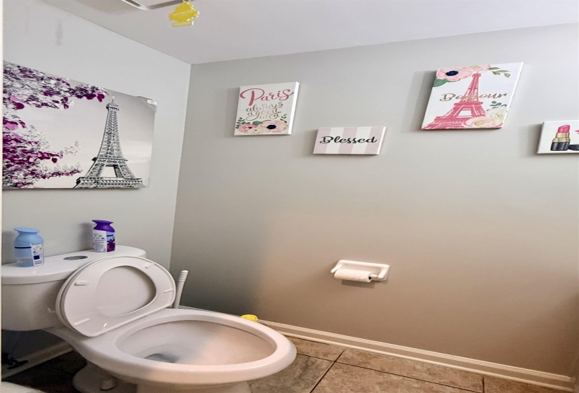 White toilet fixture with a standard tank and bowl