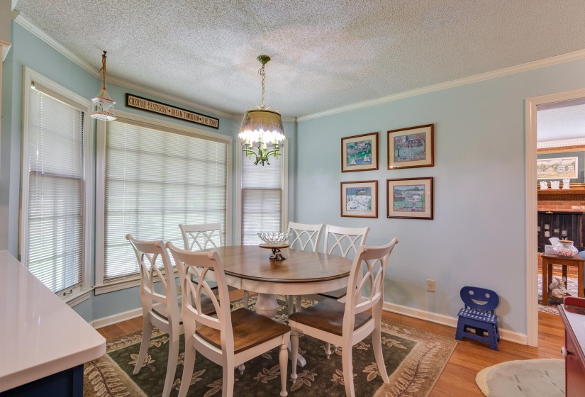 Beautiful bay windows offer views of the landscaped backyard.