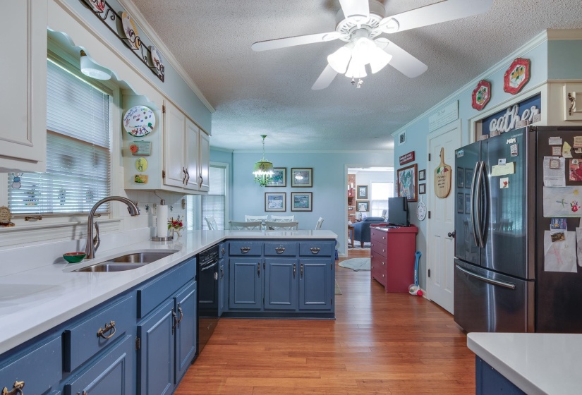 Kitchen is open to the breakfast room with views of the backyard.