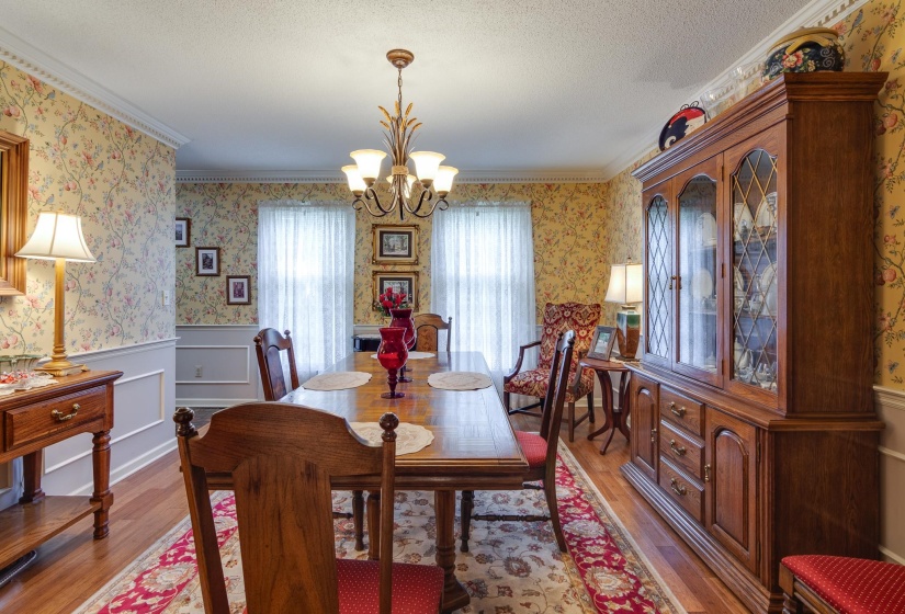 Spacious dining room with beautiful bamboo flooring.