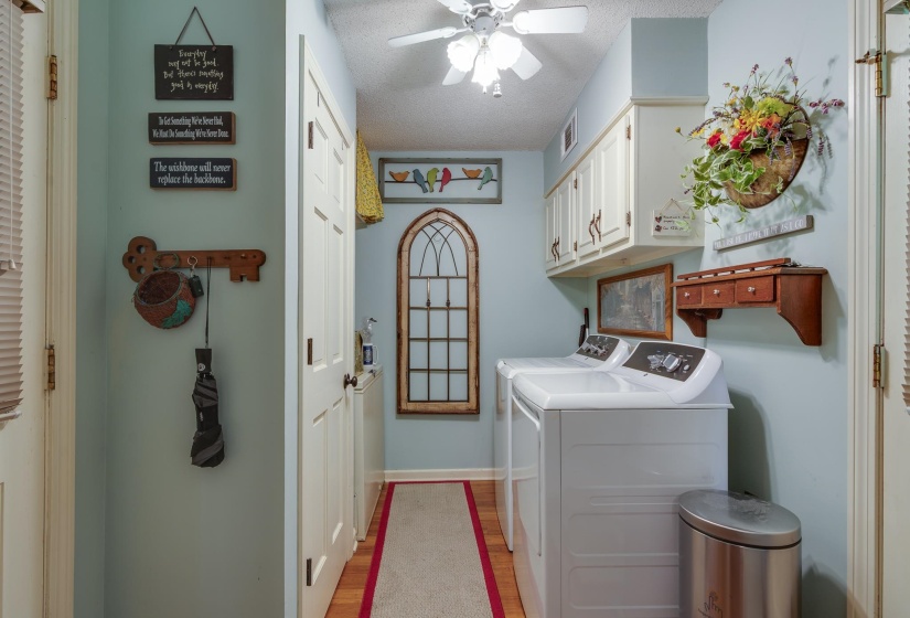 Laundry room offers cabinets and area for freezer or 2nd fridge.