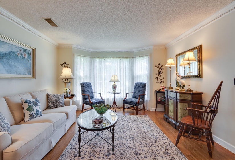 Nice living room adds additional space for family gatherings.