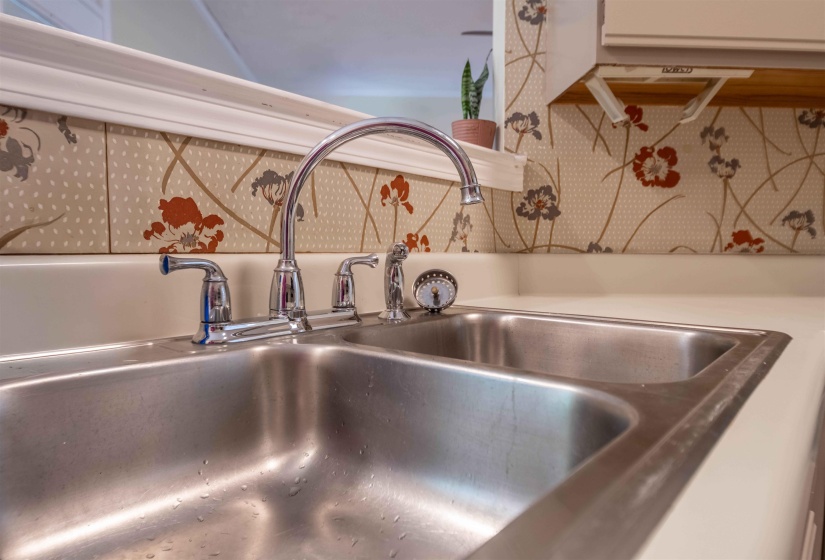 Stainless steel double basin sink with chrome faucet