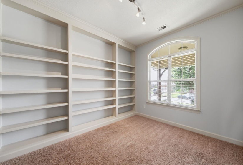 Built-in shelving units with crown molding details