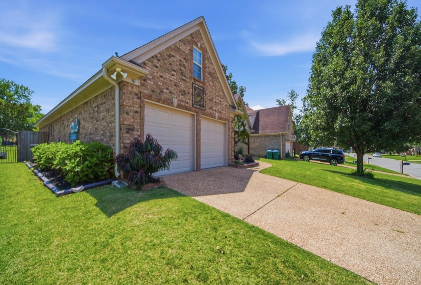 Brick exterior with a two-car garage