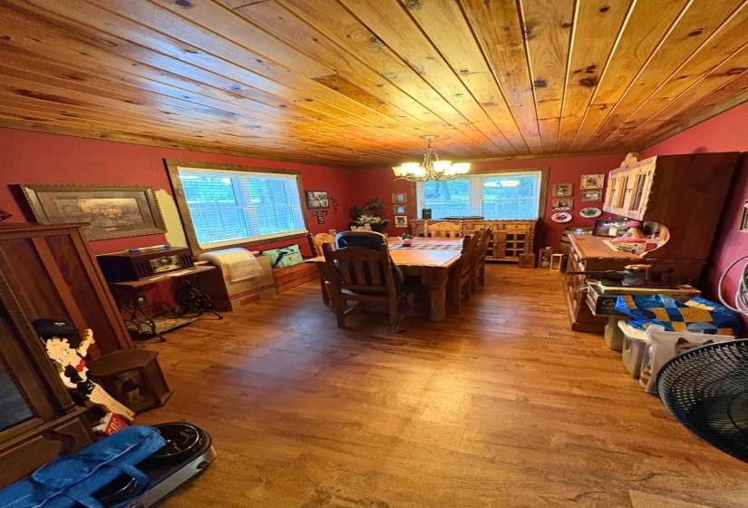 Wood-finish flooring throughout, complemented by a natural wood plank ceiling