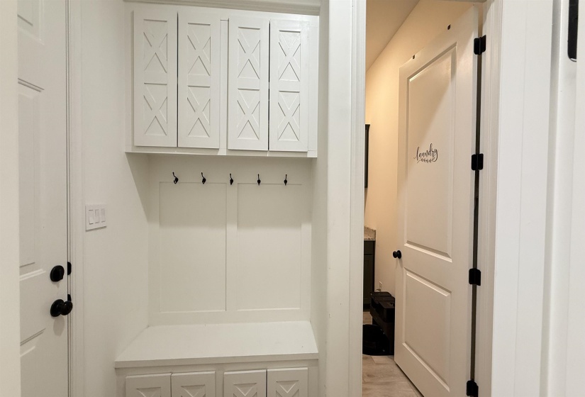 Mudroom featuring light wood-style floors
