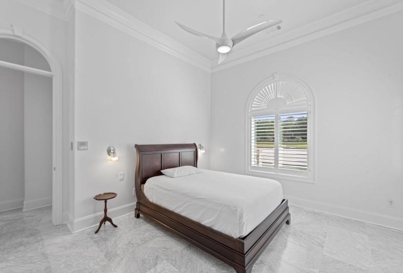 Bedroom featuring crown molding and ceiling fan
