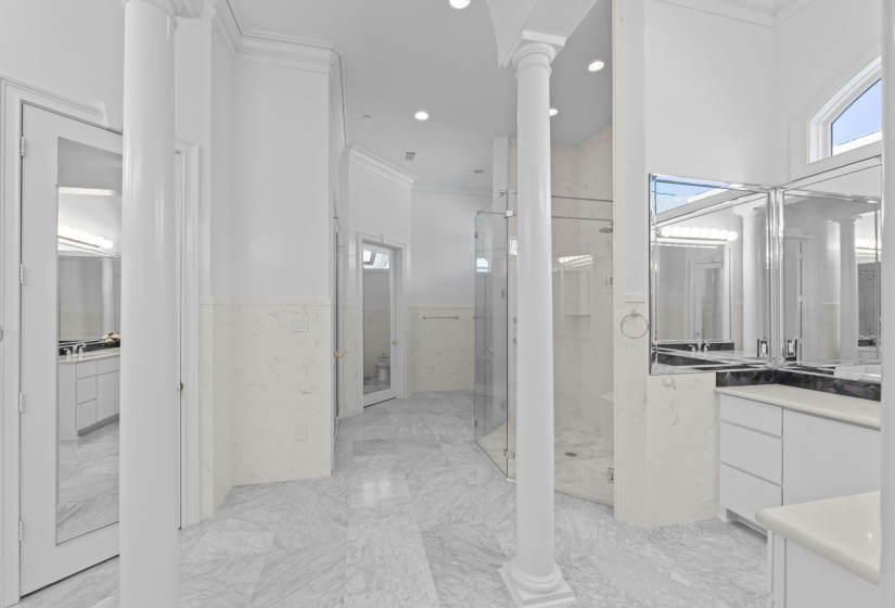 Bathroom featuring a shower stall, ornamental molding, vanity, recessed lighting, and a wainscoted wall
