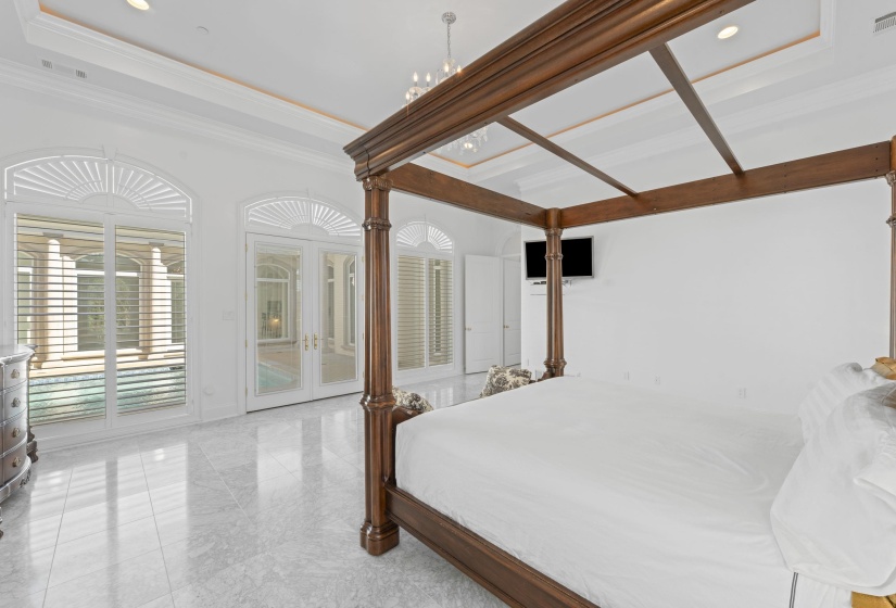Bedroom with french doors, access to outside, recessed lighting, and crown molding