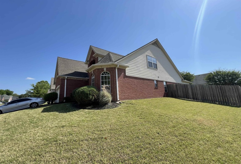 Brick and siding exterior featuring a multi-gabled roofline