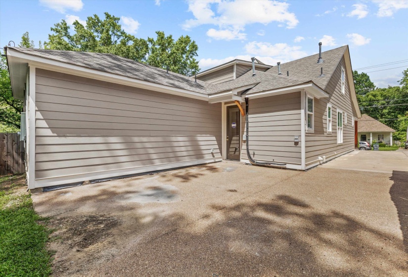 Exterior featuring horizontal siding, a composite shingle roof, and multiple windows