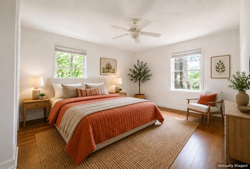 Bright interior featuring wood-finish flooring and white walls