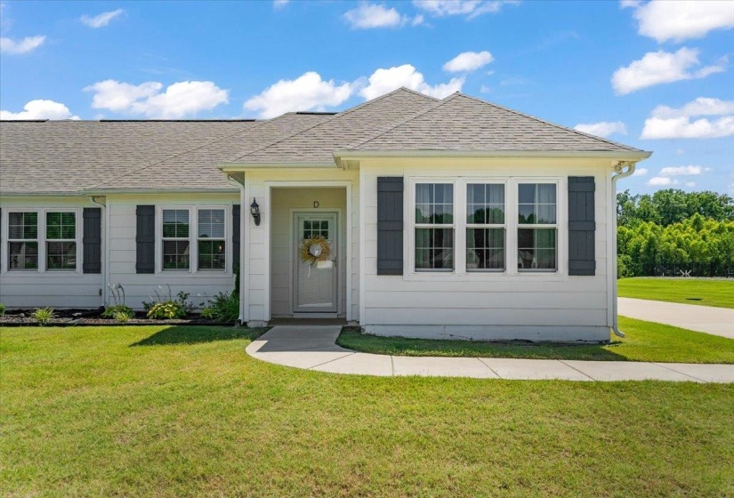 Single-story residence featuring white siding and a gray shingle roof