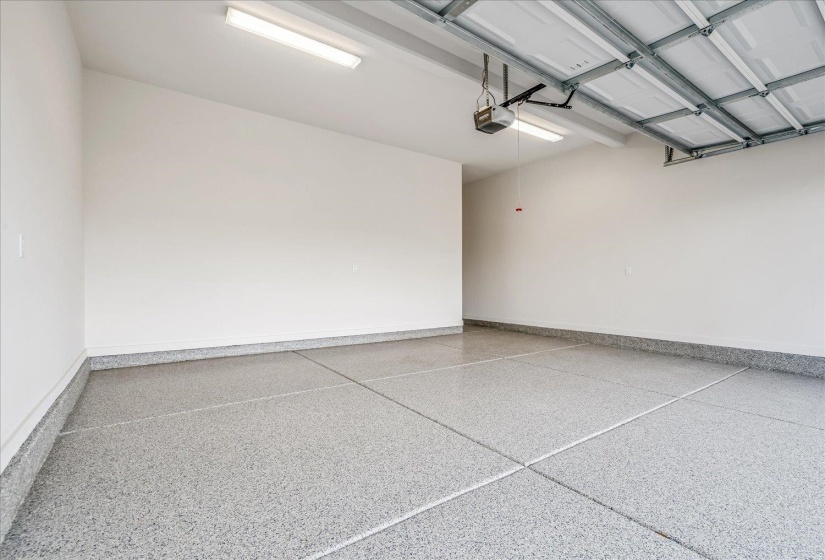 Garage featuring baseboards